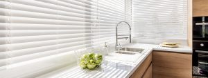 Blinds in a bright modern kitchen.